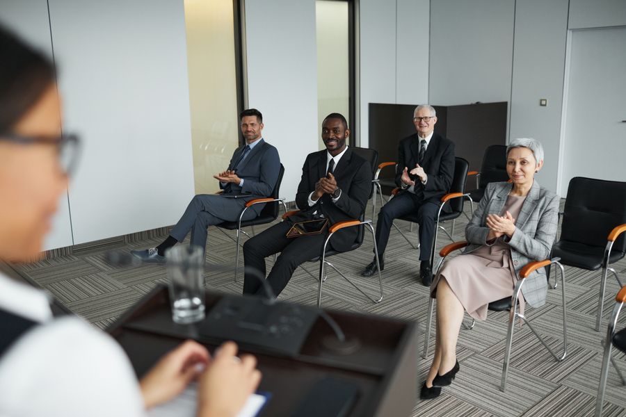 A panel discussion in front of an audience